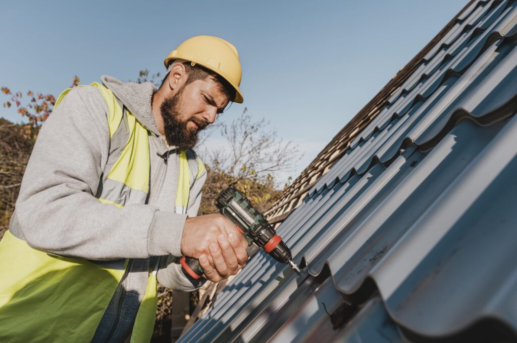 sideways-man-working-roof-with-drill-min - roof replacement crest hill il